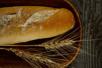 Fresh bread baguette loaf with seeds in a rustic style. Baking homemade healthy bread