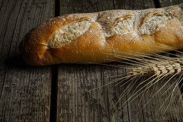 Fresh bread baguette loaf with seeds in a rustic style. Baking homemade healthy bread