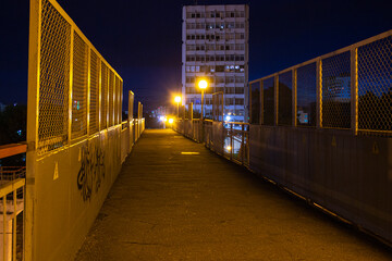 Night city view in the light of yellow lamps