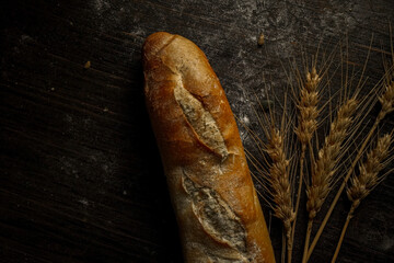 Fresh bread baguette loaf with seeds in a rustic style. Baking homemade healthy bread