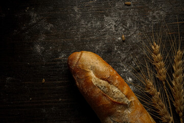 Fresh bread baguette loaf with seeds in a rustic style. Baking homemade healthy bread