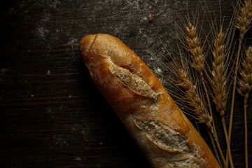 Fresh bread baguette loaf with seeds in a rustic style. Baking homemade healthy bread