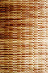 Wicker background made of natural straw. Full frame of densely woven straw pattern. Natural, natural background