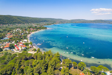 Halkidiki Peninsula, Greece. Amazing breathtaking Greek Karydi Beach seen from aerial drone view. Shallow sea water in amazing turquoise color. High quality photo