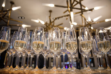 Row of champagne glasses at a wedding party