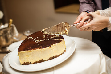 Wedding cake on the table with cream and chocolate