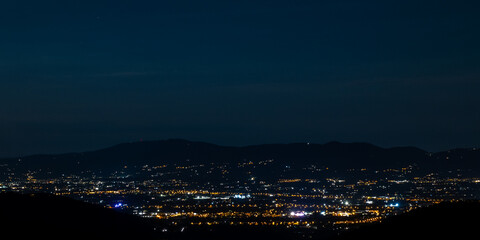 Night panorama of an Italian city in Tuscany