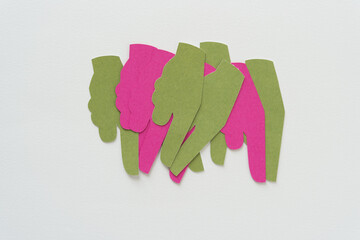 pink and green pictographic glyphs (hand with pointing finger) on blank paper