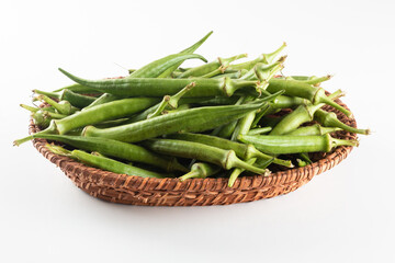 Fresh green okra in basket. Caruru ingredient.