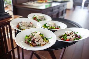 Dish on a round plate on the wedding table