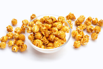 Honey caramel popcorn on white background.