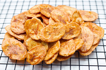 Banana chips on white background