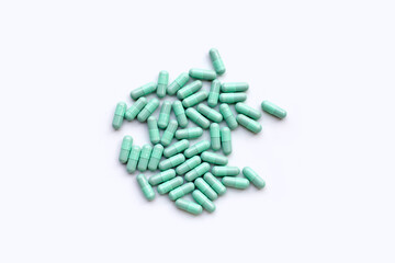 Blue capsules on white background