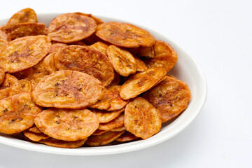 Banana chips on white background