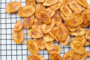 Banana chips on white background
