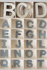 shallow wood box with galvanized steel letters alphabet