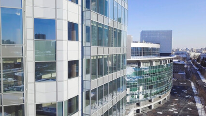 Closeup building glass of skyscrapers with cloud, Business concept of architecture. Reflection of the city in the Windows of a skyscraper