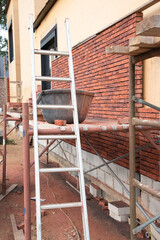building a house supporting structure for laying bricks around a wooden base