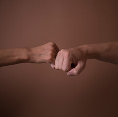 two hands shaking hands. Couple hands concept. Man and woman posing. Studio Light. Life. Gesture. 