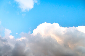Abstract and background of long white morning cloud with sunlight hiding a secondary matter within. with blue sky.