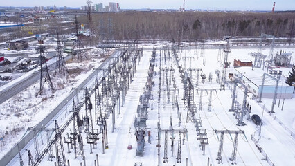 Rows of electric poles of substation. Action. Top view of small electrical substation with rows of...