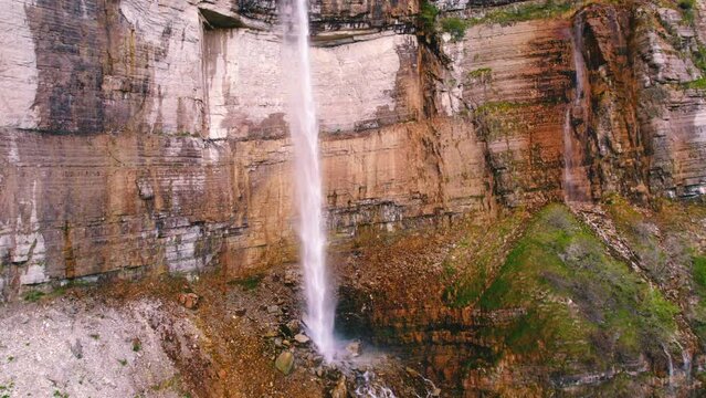 Scenic drone shot of a high cliff with an enormous waterfall, Okatse, Georgia, Europe. High quality 4k footage