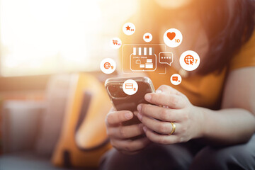 Online shopping and mobile business concept. Woman uses smartphone for online shopping. Pay online using Application to login to the bank via mobile phone
