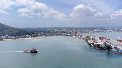 Obraz premium Aerial side on top view of cargo ship carrying container and running for export cargo yard port to custom in international ocean.