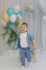 Boy with balloon in the interior