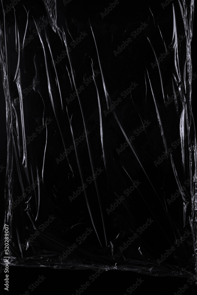 Aufkleber black transparent plastic wrap texture overlay background. realistic plastic for poster design and p