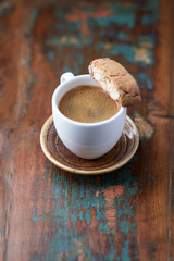 Cup of coffee and Cantuccini (Italian cookie) on dark wooden background. Copy space.