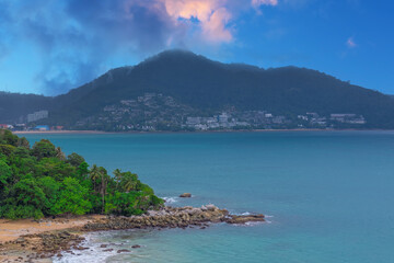 Colourful Skies Sunset over Head Laem Sing Beach in Phuket Thailand. This Lovely island waters are turquoise blue waters, lush green mountains colourful skies and beautiful views of Pa Tong Patong