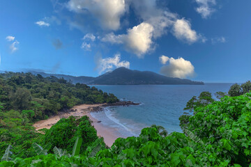 Colourful Skies Sunset over Head Laem Sing Beach in Phuket Thailand. This Lovely island waters are turquoise blue waters, lush green mountains colourful skies and beautiful views of Pa Tong Patong