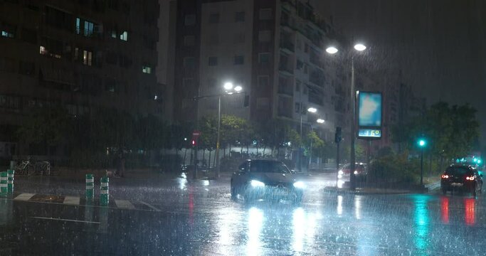 Transport traffic in the street under the rain at night