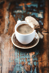 Cup of coffee and Cantuccini (Italian cookie) on dark wooden background. Copy space.