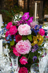 Bouquet of flowers in vase on the wedding table