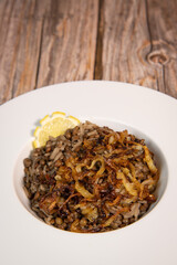 VEGAN LEBANESE LENTILS WITH GOLDEN ONIONS AND RICE RECIPE , MDARDARA B'RIZ. High quality photo