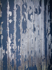 Old wood with peeling grey paint