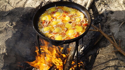 scrambled eggs on the fire