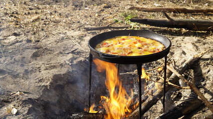 scrambled eggs on the fire