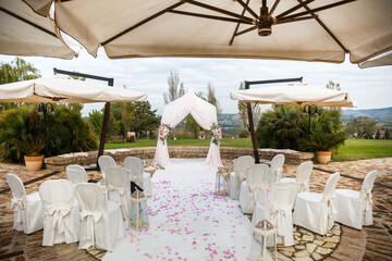 Outdoor wedding ceremony in a green garden