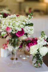 Bouquet of flowers in vase on the wedding table