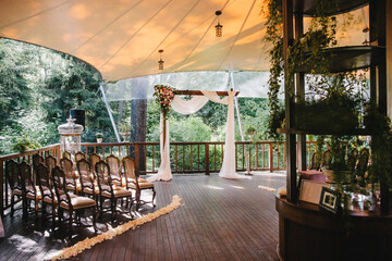 Outdoor wedding ceremony on a wooden balcony
