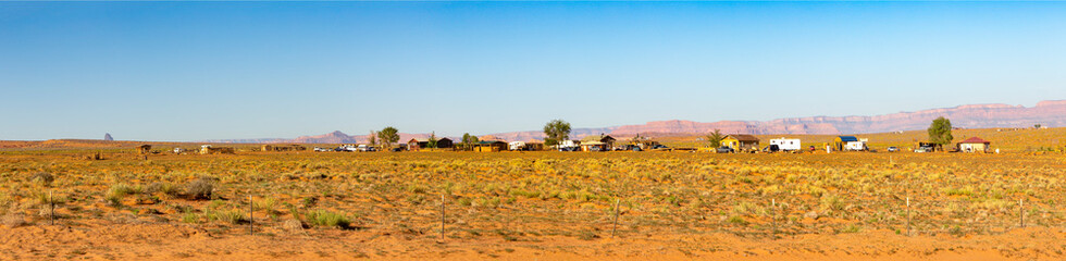 panoramic view to rural landscape with farm, fence and cars in the heat of Utah