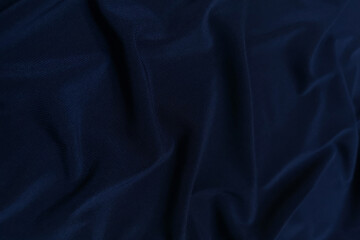 Blue crepe satin crumpled or wavy fabric texture background. Abstract linen cloth soft waves. Silk fabric. Smooth elegant luxury cloth texture. Concept for banner or advertisement.