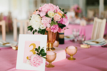 Bouquet of flowers in vase on the wedding table