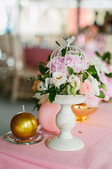 Bouquet of flowers in vase on the wedding table