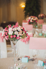 Bouquet of flowers in vase on the wedding table