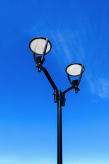 Street lighting lantern with LED lamps on a blue sky background