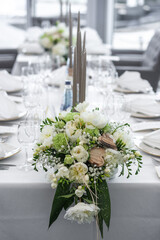 Bouquet of flowers in vase on the wedding table